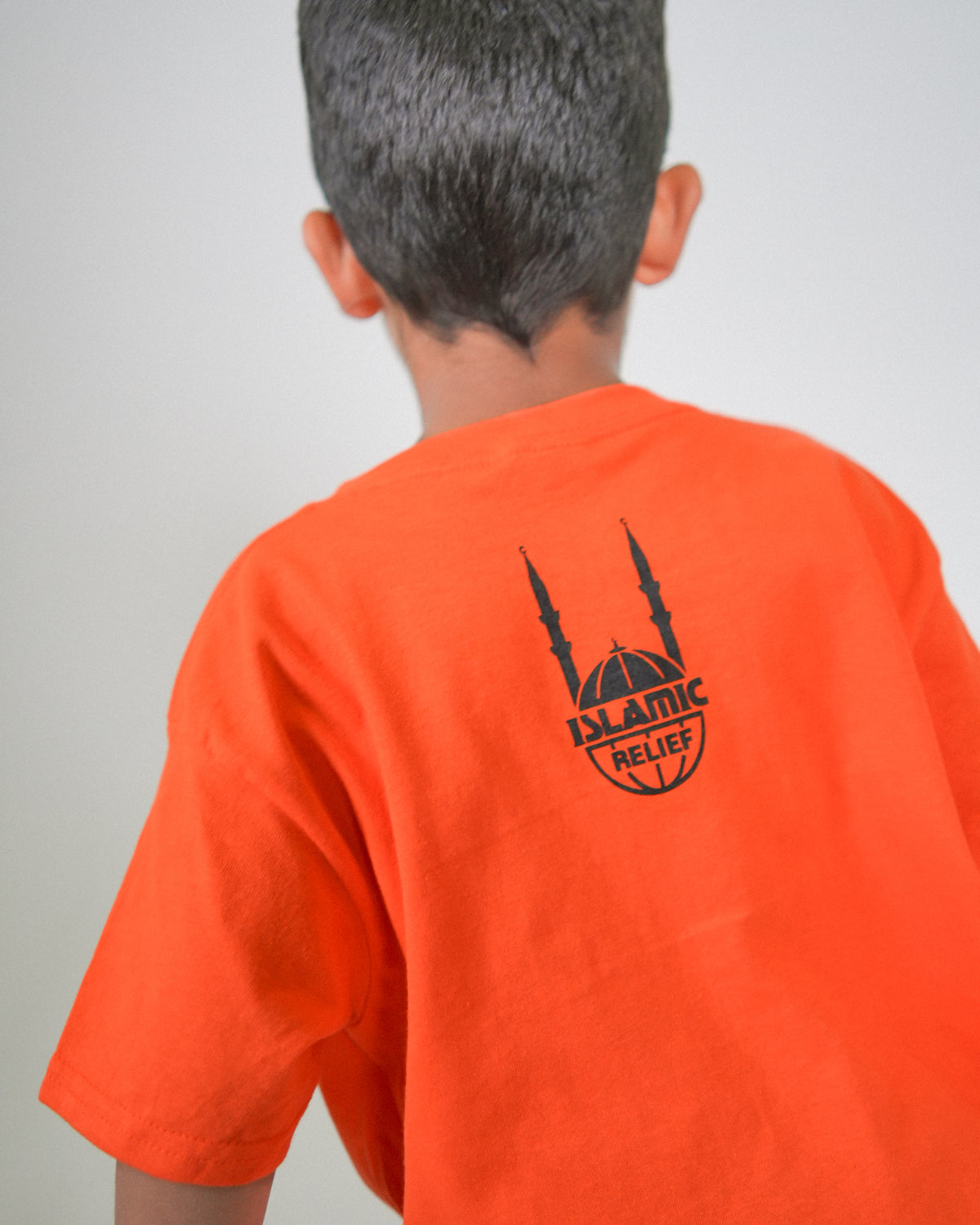 T-shirt orange à manches courtes pour enfants - Main dans la main